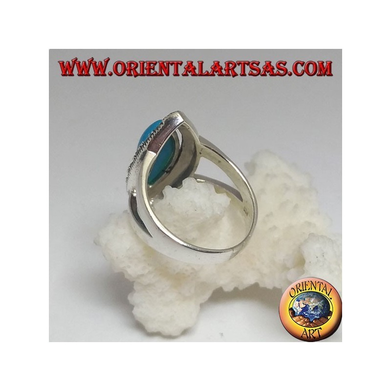 Silver ring, with turquoise cabochon cut shuttle surrounded by marcasite