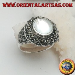 Silver ring with raised mother of pearl surrounded by marcasite
