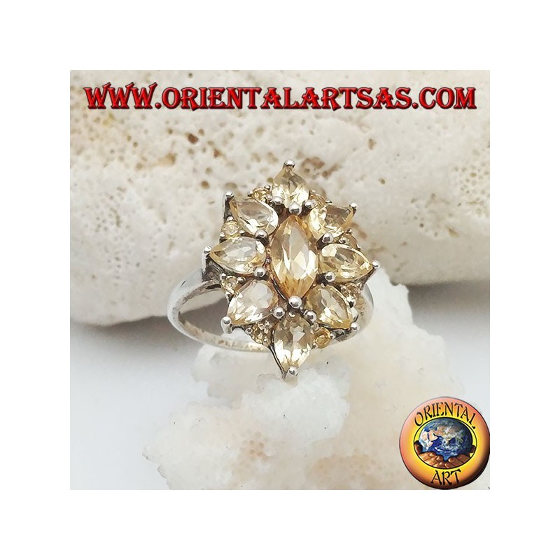 Silver oval flower ring formed by embedded shuttle citrine topazes