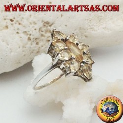 Silver oval flower ring formed by embedded shuttle citrine topazes