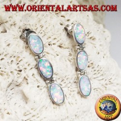 Silver lobe earrings with a row of three hanging oval white opals