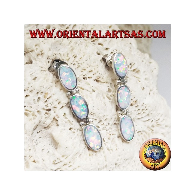 Silver lobe earrings with a row of three hanging oval white opals