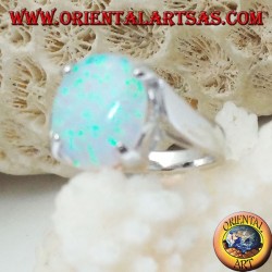 Silver ring with oval white opal set and curved frame on the sides