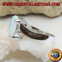 Silver ring with oval white opal set and curved frame on the sides