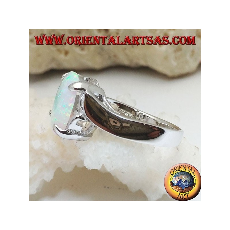 Silver ring with oval white opal set and curved frame on the sides
