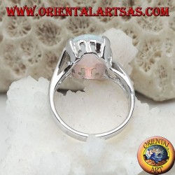 Silver ring with oval white opal set and curved frame on the sides