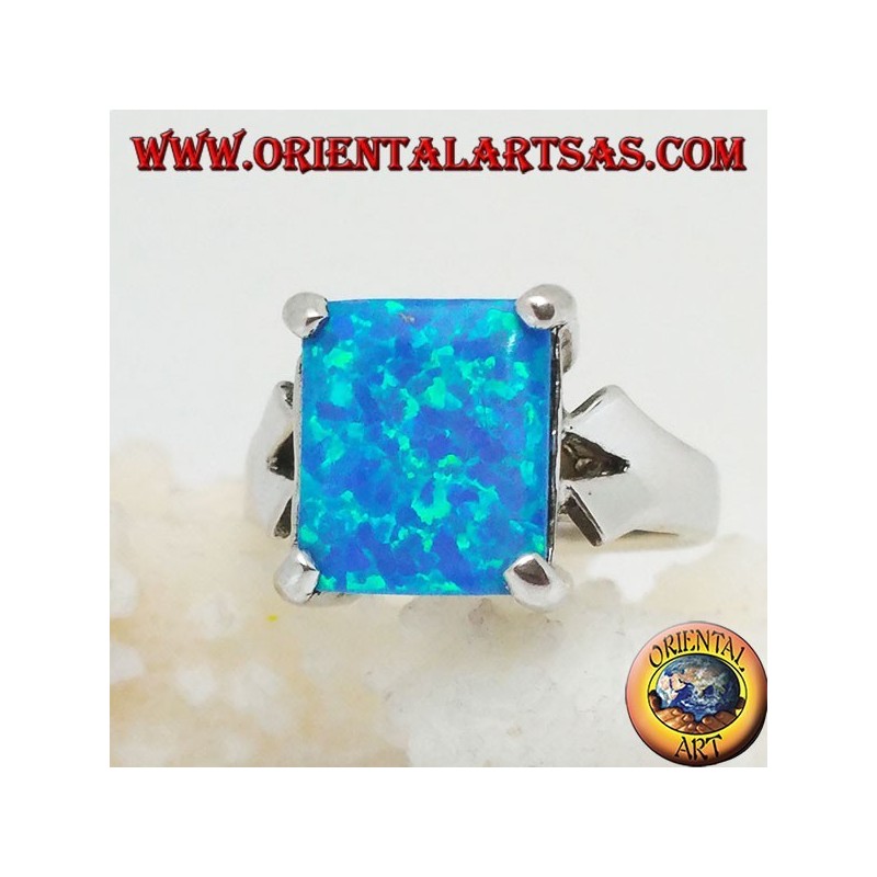 Silver ring with embedded rectangular blue fire opal and V-frame on the sides