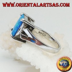 Silver ring with embedded rectangular blue fire opal and V-frame on the sides