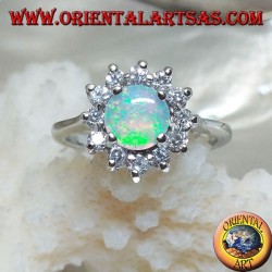Silver ring with round harlequin opal set in four surrounded by cubic zirconia