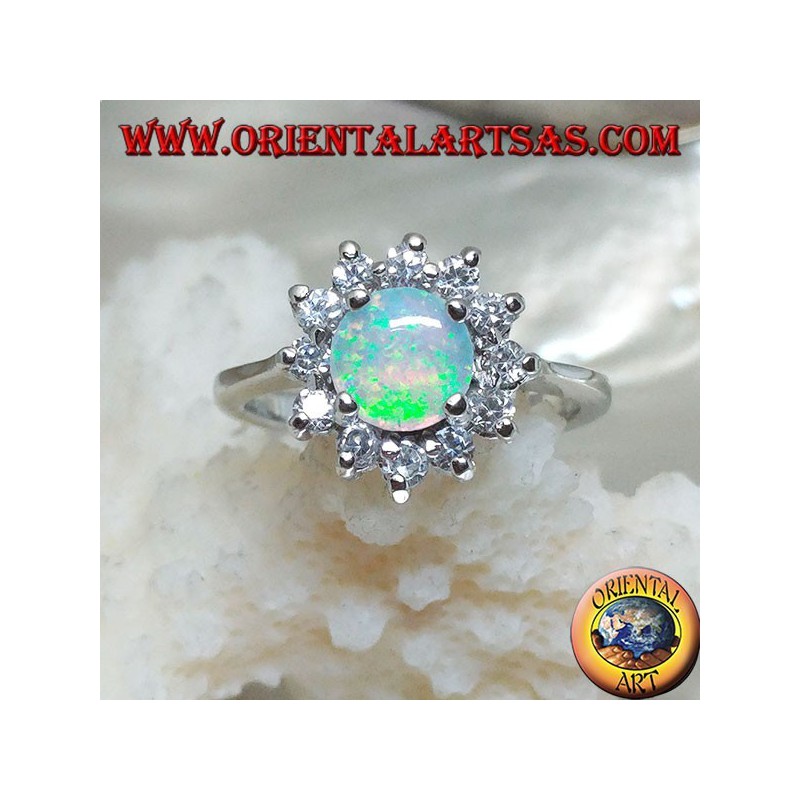 Silver ring with round harlequin opal set in four surrounded by cubic zirconia