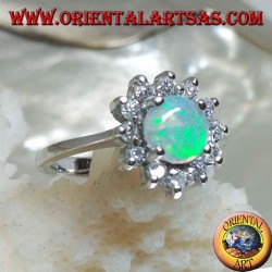 Silver ring with round harlequin opal set in four surrounded by cubic zirconia