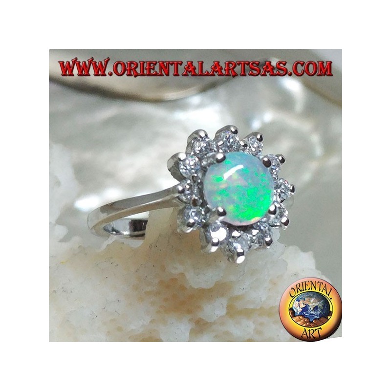 Silver ring with round harlequin opal set in four surrounded by cubic zirconia