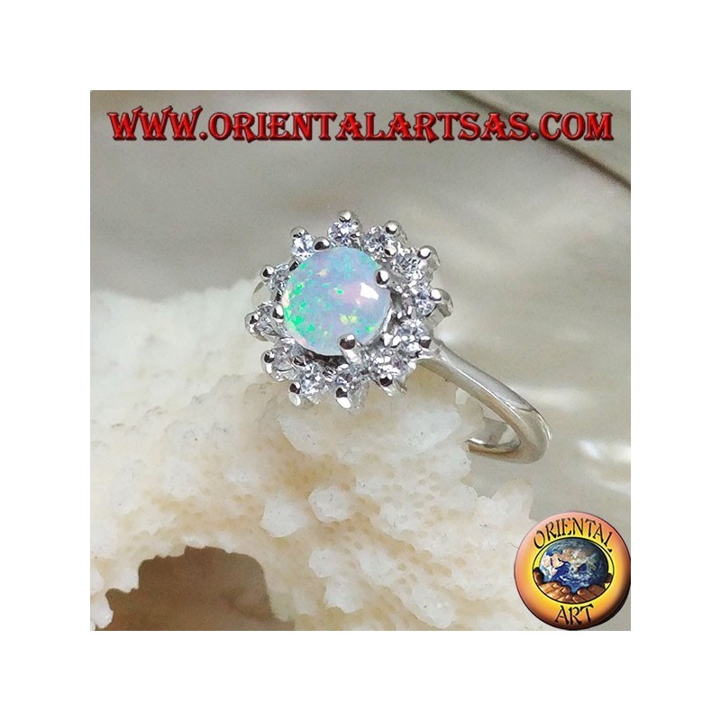 Silver ring with round harlequin opal set in four surrounded by cubic zirconia