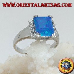 Silver ring with rectangular blue opal set in four and row of zircons on the sides