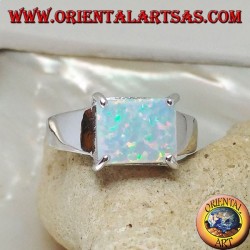 Silver ring with horizontal rectangular harlequin opal set in four