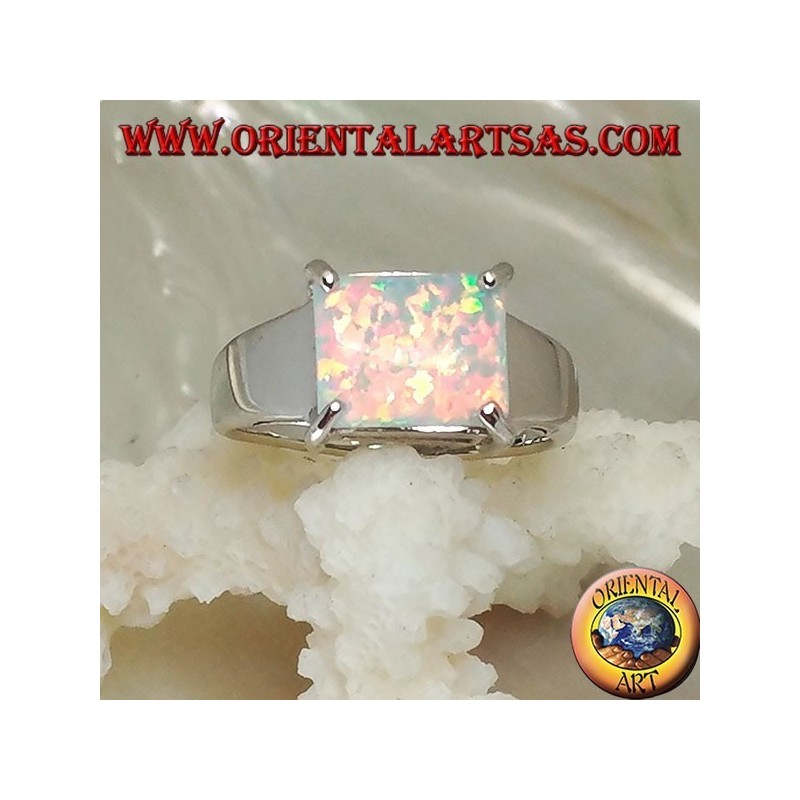 Silver ring with horizontal rectangular harlequin opal set in four