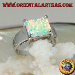 Silver ring with horizontal rectangular harlequin opal set in four