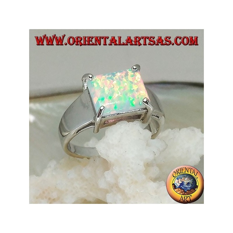 Silver ring with horizontal rectangular harlequin opal set in four