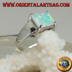 Silver ring with horizontal rectangular harlequin opal set in four