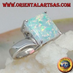 Silver ring with square harlequin opal set in four and asymmetrical setting