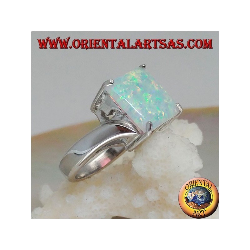 Silver ring with square harlequin opal set in four and asymmetrical setting