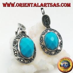 Boucles d'oreilles en argent avec cabochon ovale à facettes turquoise entourées d'une broderie d'étoiles et de marcassite