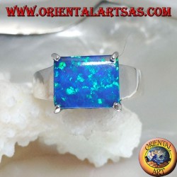 Silver ring with horizontal rectangular blue opal set in four