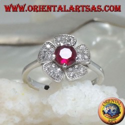 Silver ring in the shape of a wild strawberry flower with a garnet corolla set and zircon petals