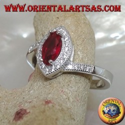 Silver ring with shuttle garnet set surrounded by zircons and asymmetrical setting