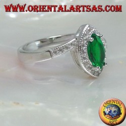 Silver ring with synthetic shuttle emerald set surrounded by zircons on an asymmetrical setting