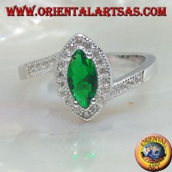 Silver ring with synthetic shuttle emerald set surrounded by zircons on an asymmetrical setting