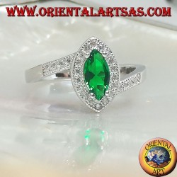 Silver ring with synthetic shuttle emerald set surrounded by zircons on an asymmetrical setting
