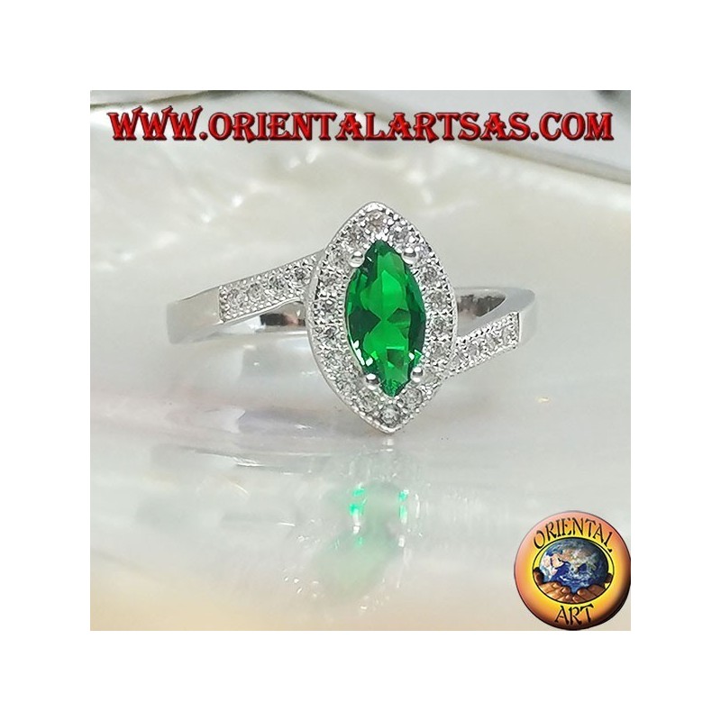 Silver ring with synthetic shuttle emerald set surrounded by zircons on an asymmetrical setting