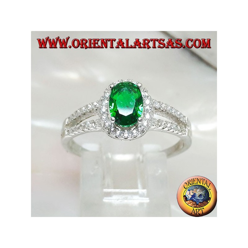 Silver ring with oval synthetic emerald set surrounded by zircons and two lateral lines