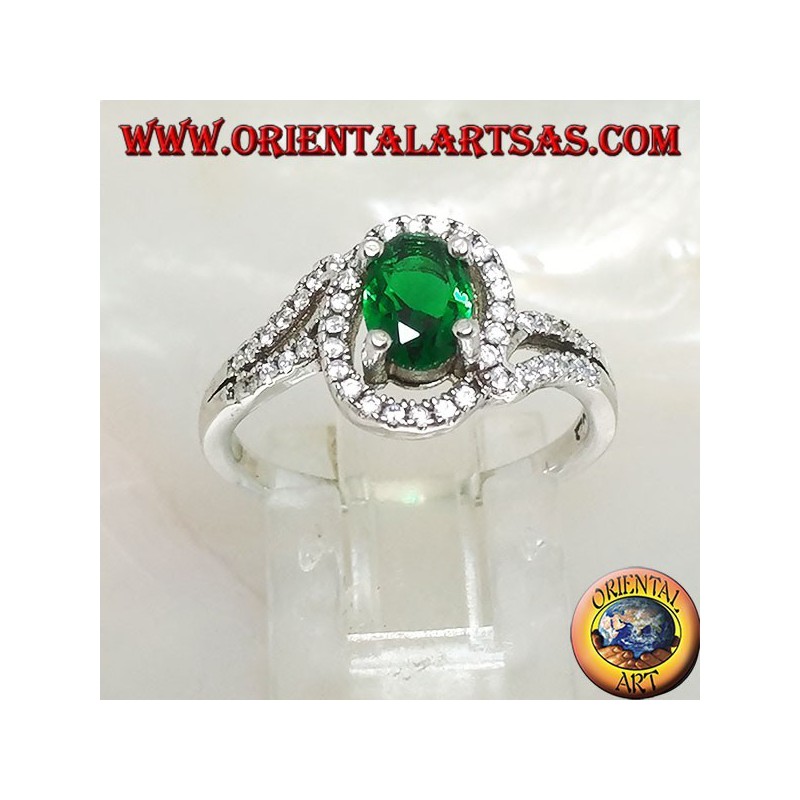 Silver ring with oval synthetic emerald set surrounded by zircons on a concentric setting