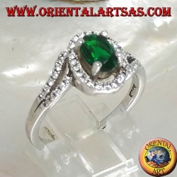Silver ring with oval synthetic emerald set surrounded by zircons on a concentric setting