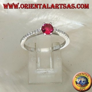 Silver ring with round synthetic ruby set on a thin row of cubic zirconia setting