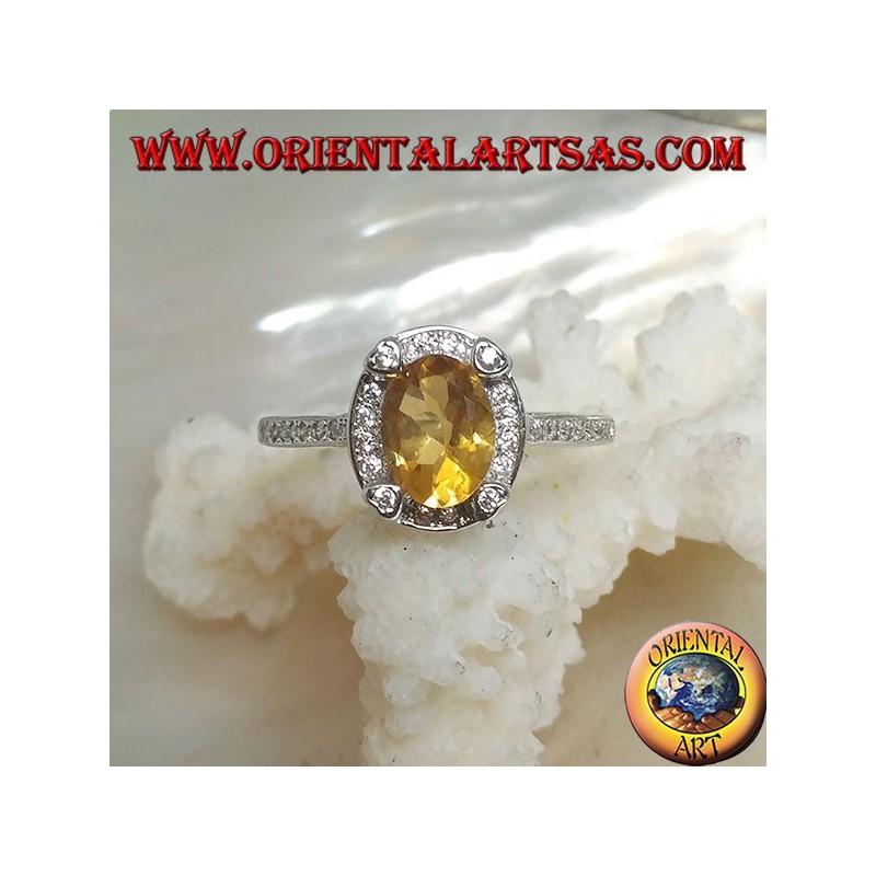Bague en argent avec topaze jaune naturelle ovale entourée de zircone cubique et avec quatre zircones cubiques en relief