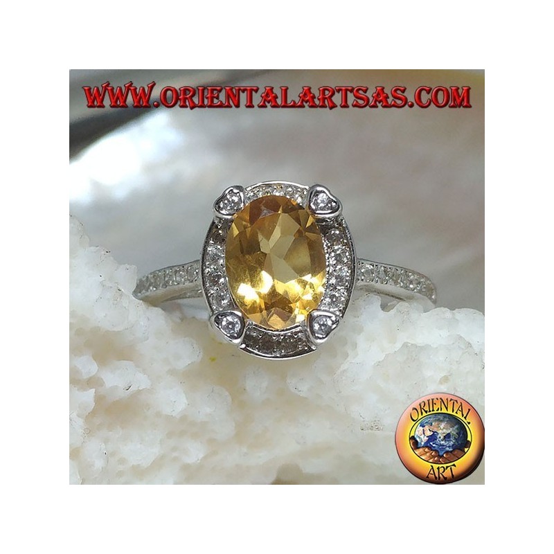 Bague en argent avec topaze jaune naturelle ovale entourée de zircone cubique et avec quatre zircones cubiques en relief
