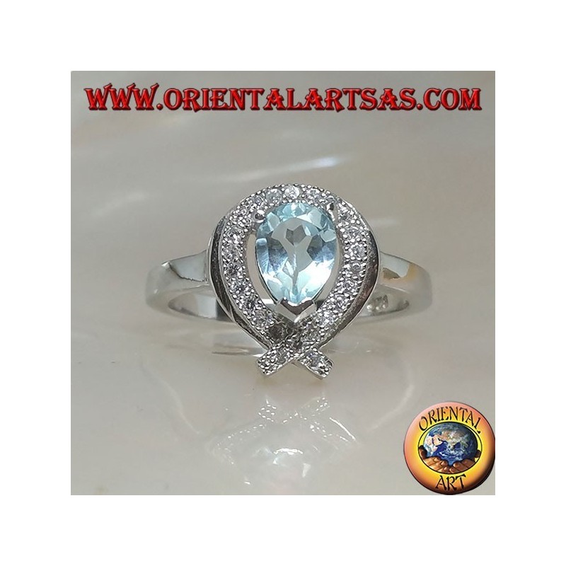 Silver ring with natural blue drop topaz surrounded by zircons (intersection on tip)
