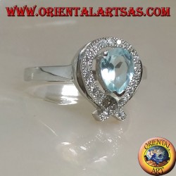 Silver ring with natural blue drop topaz surrounded by zircons (intersection on tip)
