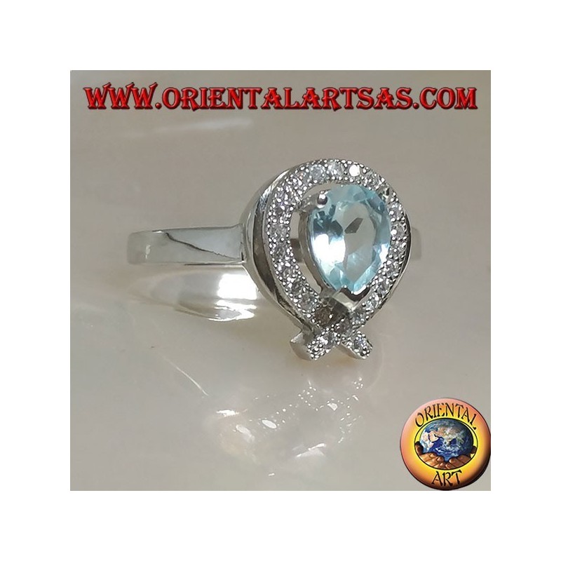 Bague en argent avec topaze goutte bleue naturelle entourée de zircons (intersection sur la pointe)