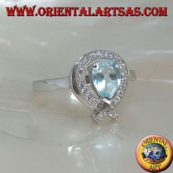 Silver ring with natural blue drop topaz surrounded by zircons (intersection on tip)