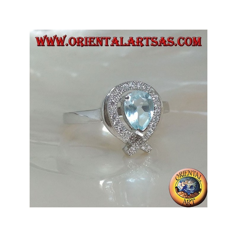 Bague en argent avec topaze goutte bleue naturelle entourée de zircons (intersection sur la pointe)