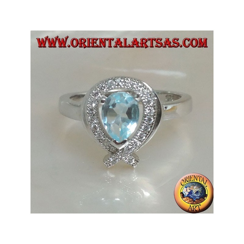 Silver ring with natural blue drop topaz surrounded by zircons (intersection on tip)