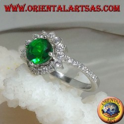 Silver ring with round synthetic emerald set surrounded by small and large zircons
