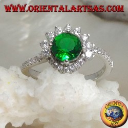 Silver ring with round synthetic emerald set surrounded by small and large zircons