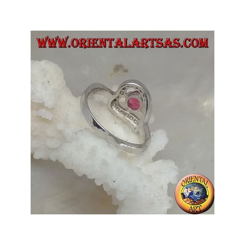 Silver ring in the shape of a horizontal heart with a synthetic round ruby set surrounded by zircons