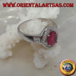Silver ring with oval synthetic ruby set surrounded by cubic zirconia and square on the sides