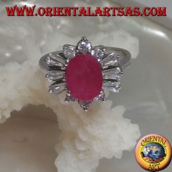 Silver ring with oval natural ruby surrounded by triple round zircons and alternating trapezoids